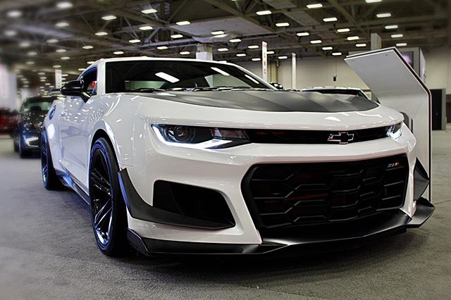 Chevy Camaro is front and center! Come see more muscle cars at the #dfwautoshow! #camaro #chevy #carshow #musclecars